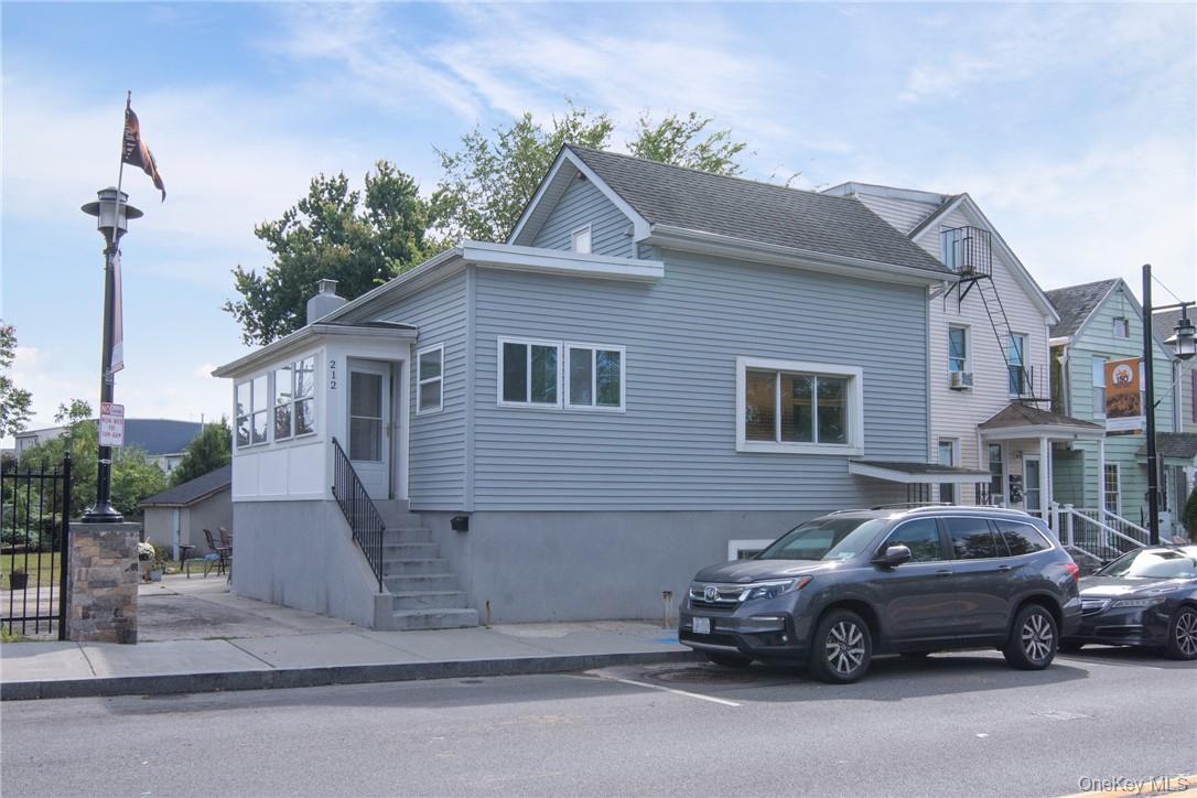 Welcome to 212 Beekman Avenue, a versatile multi-family property with...