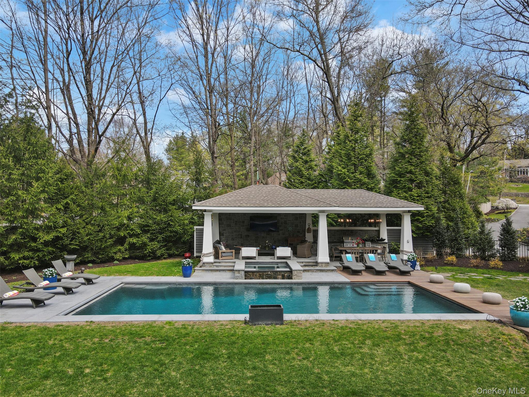 Set on 3.19 acres of tranquil woodland in a coveted Rye Brook enclave,...