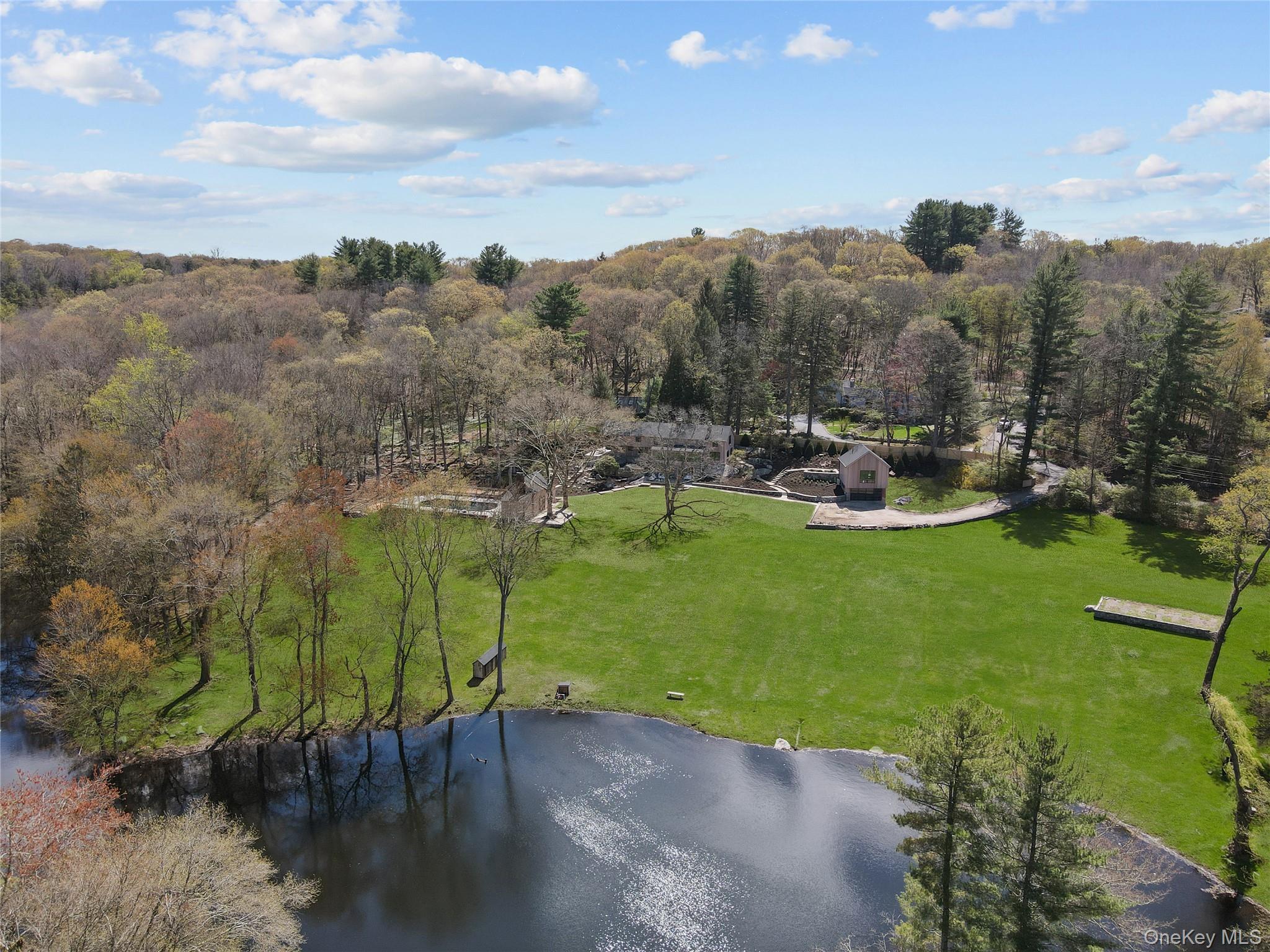 Behind private gates, nearly six acres of bucolic countryside unfold a...