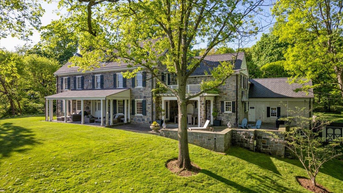 Unique and rare Irvington village stone home on a shy 4-acres nestled...