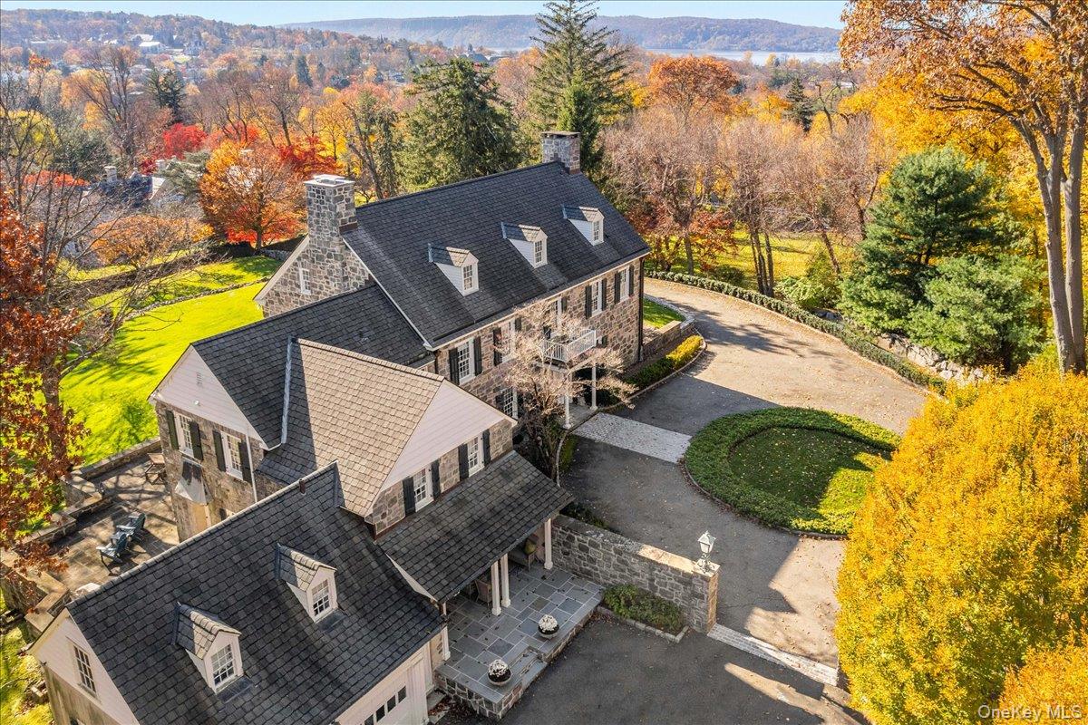 Unique and rare Irvington village stone home on a shy 4-acres nestled...