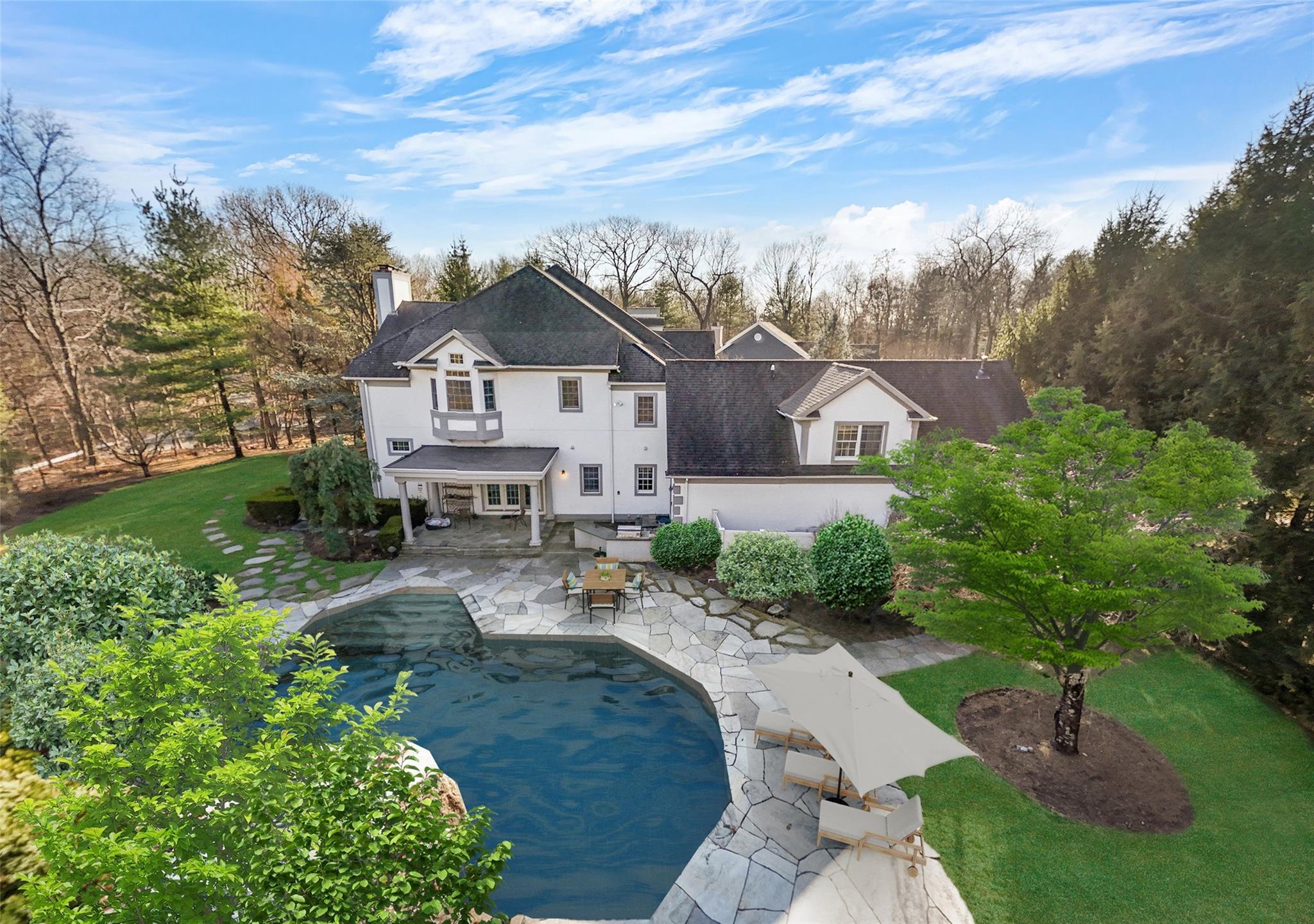 This exceptional custom colonial in Legend Hollow is nestled at the en...
