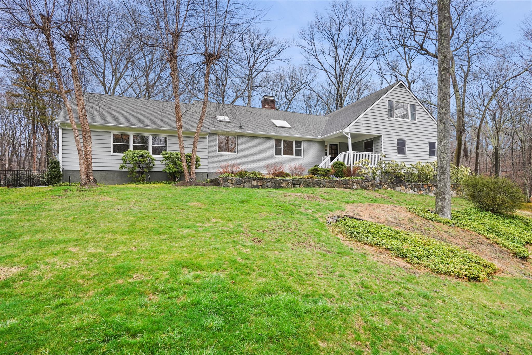 Nestled on 2.00 acres of lush, park-like grounds that backup to 69+ ac...