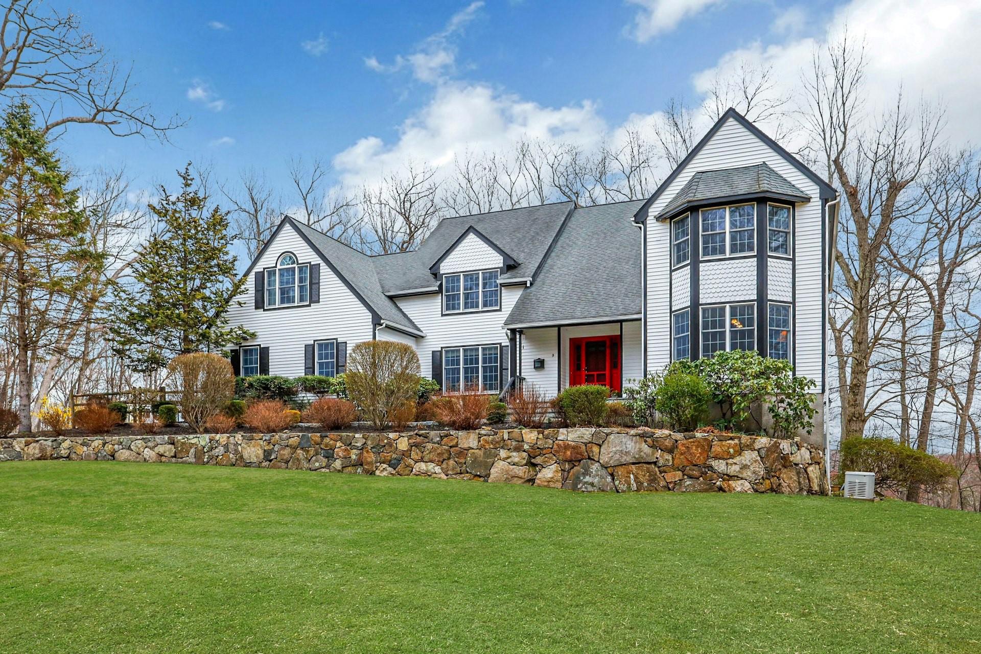 Welcome home! This classic colonial sited on 4.41 acres with rolling h...