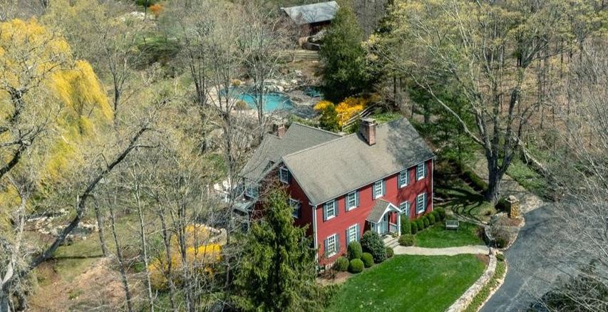Arrive through a tree-lined drive to discover a hidden gem of stone wa...