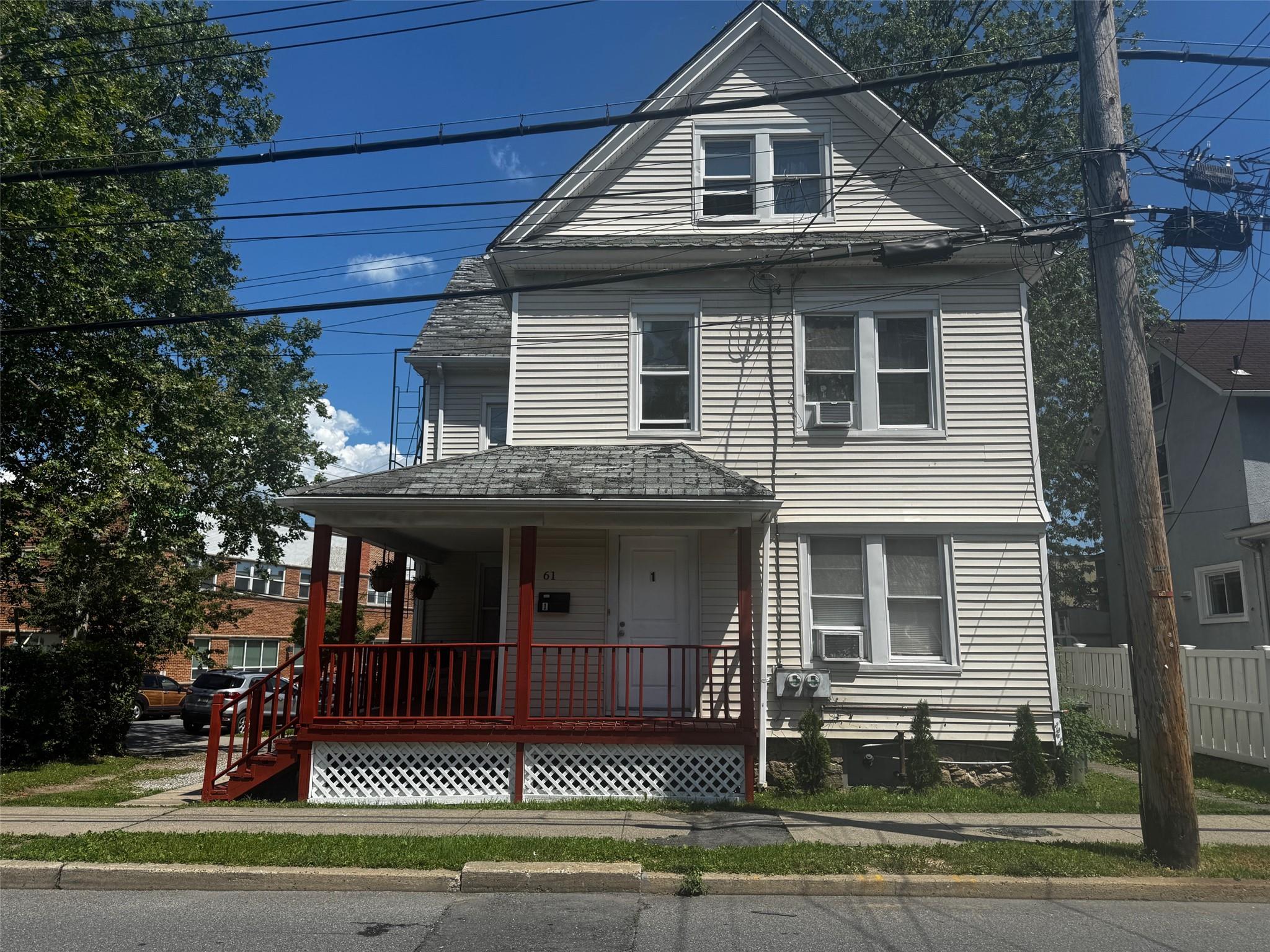 Two family property offers a two-bedroom unit, living room and eat in...