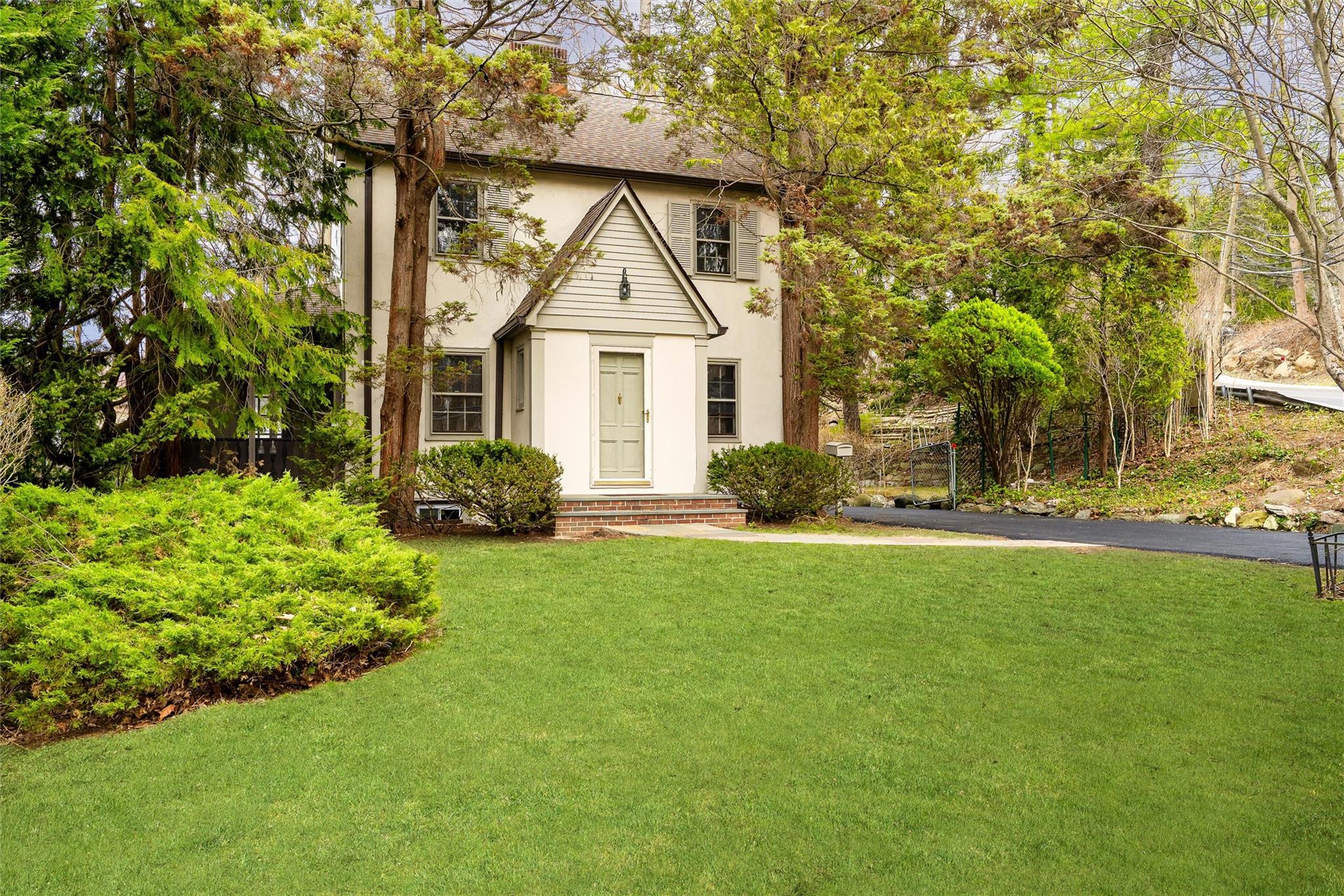 Welcome to this charming Tudor-style residence, where timeless archite...