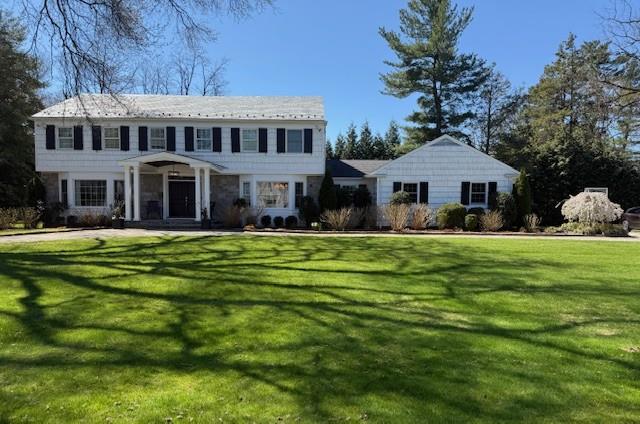 Welcome to this stunning Colonial nestled on one acre of pure serenity...
