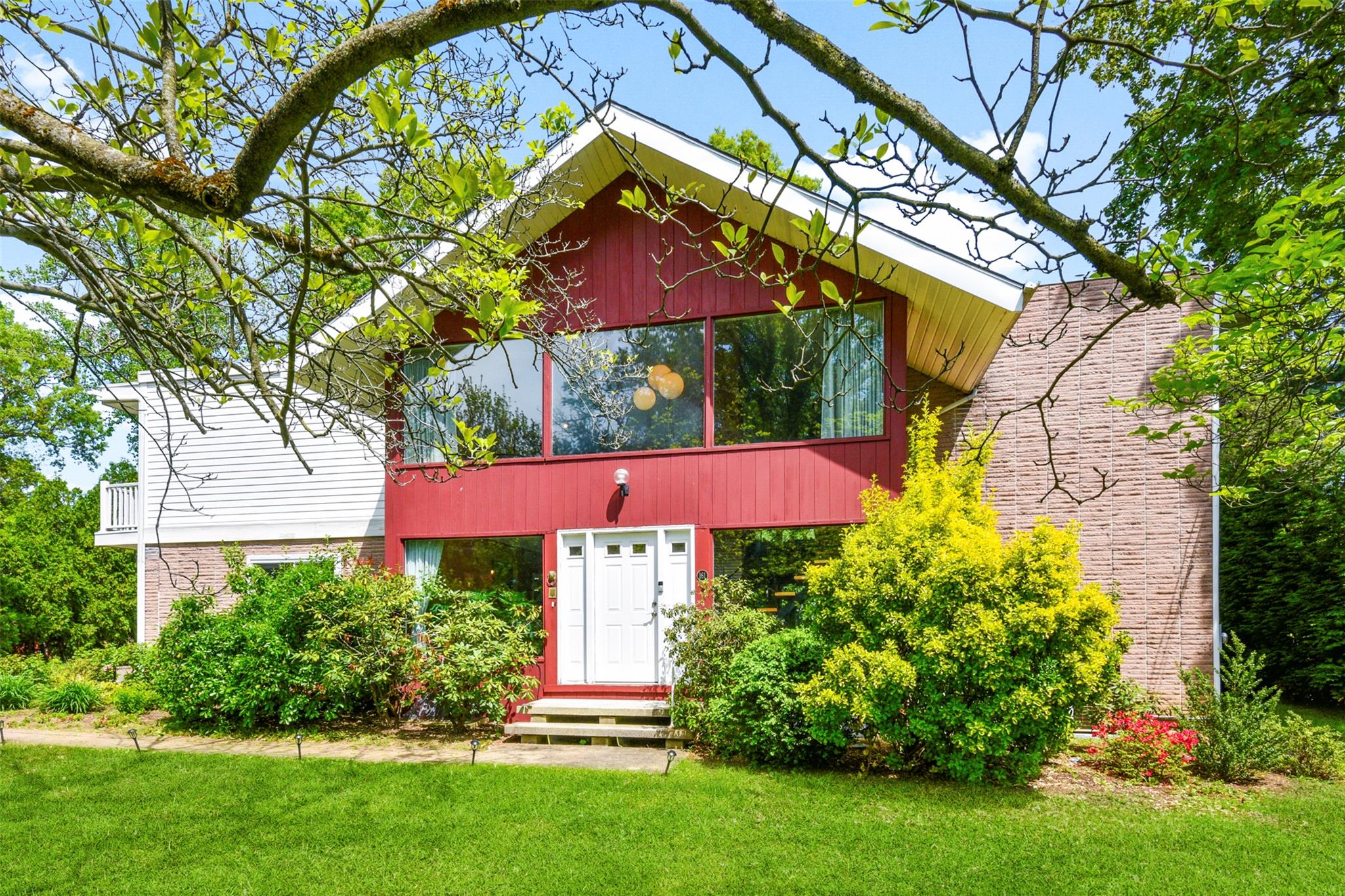 This stunning Mid-Century Modern residence is ideally situated on one...