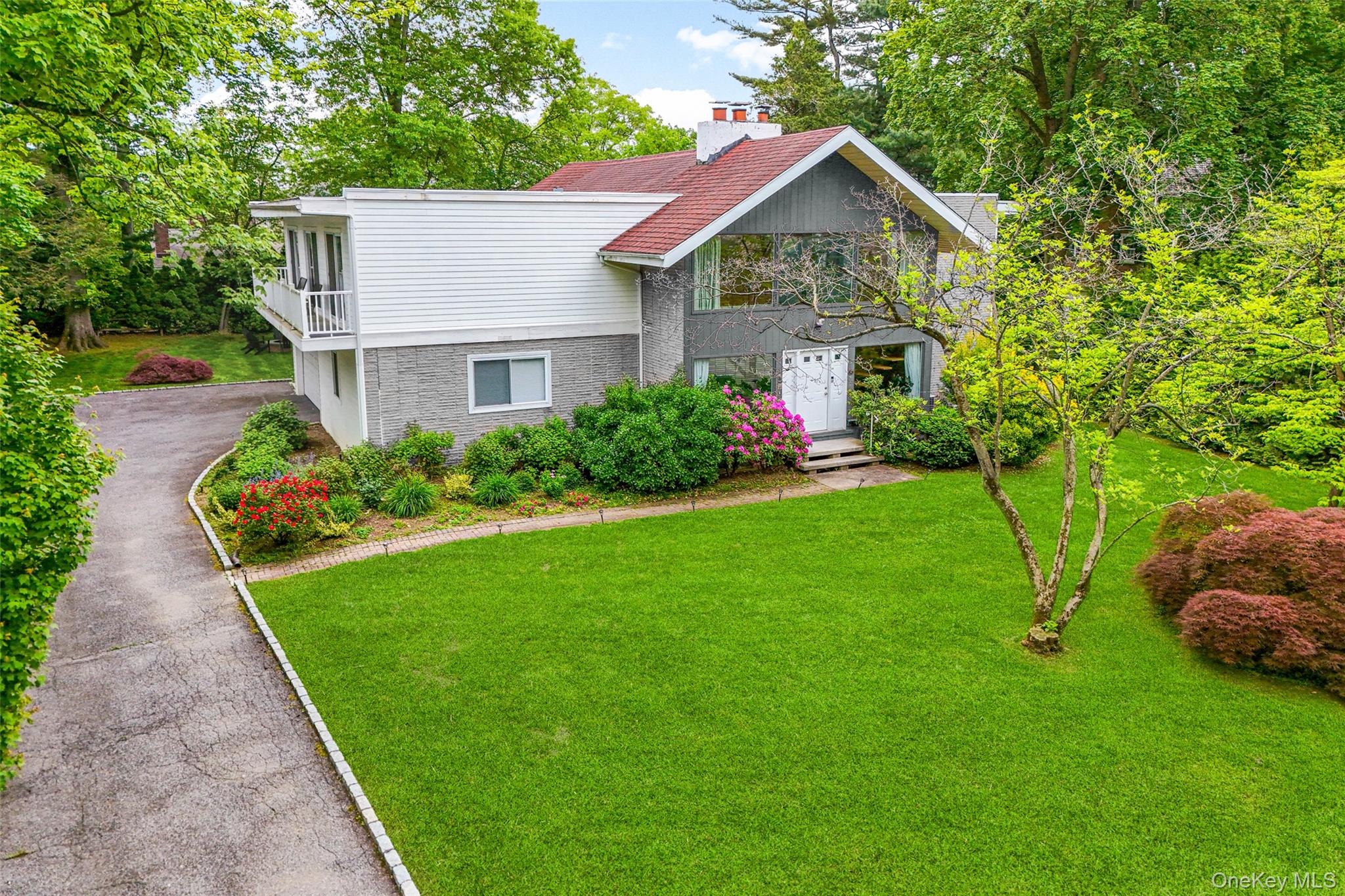 This stunning Mid-Century Modern residence is ideally situated on one...