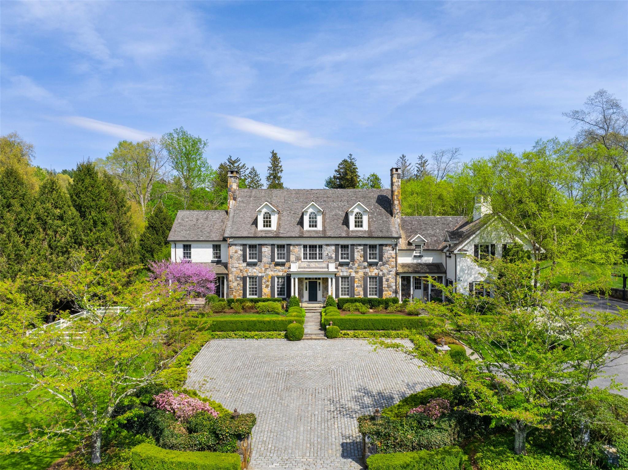 Stately and Refined. Long, gated drive, lined with flowering perennial...