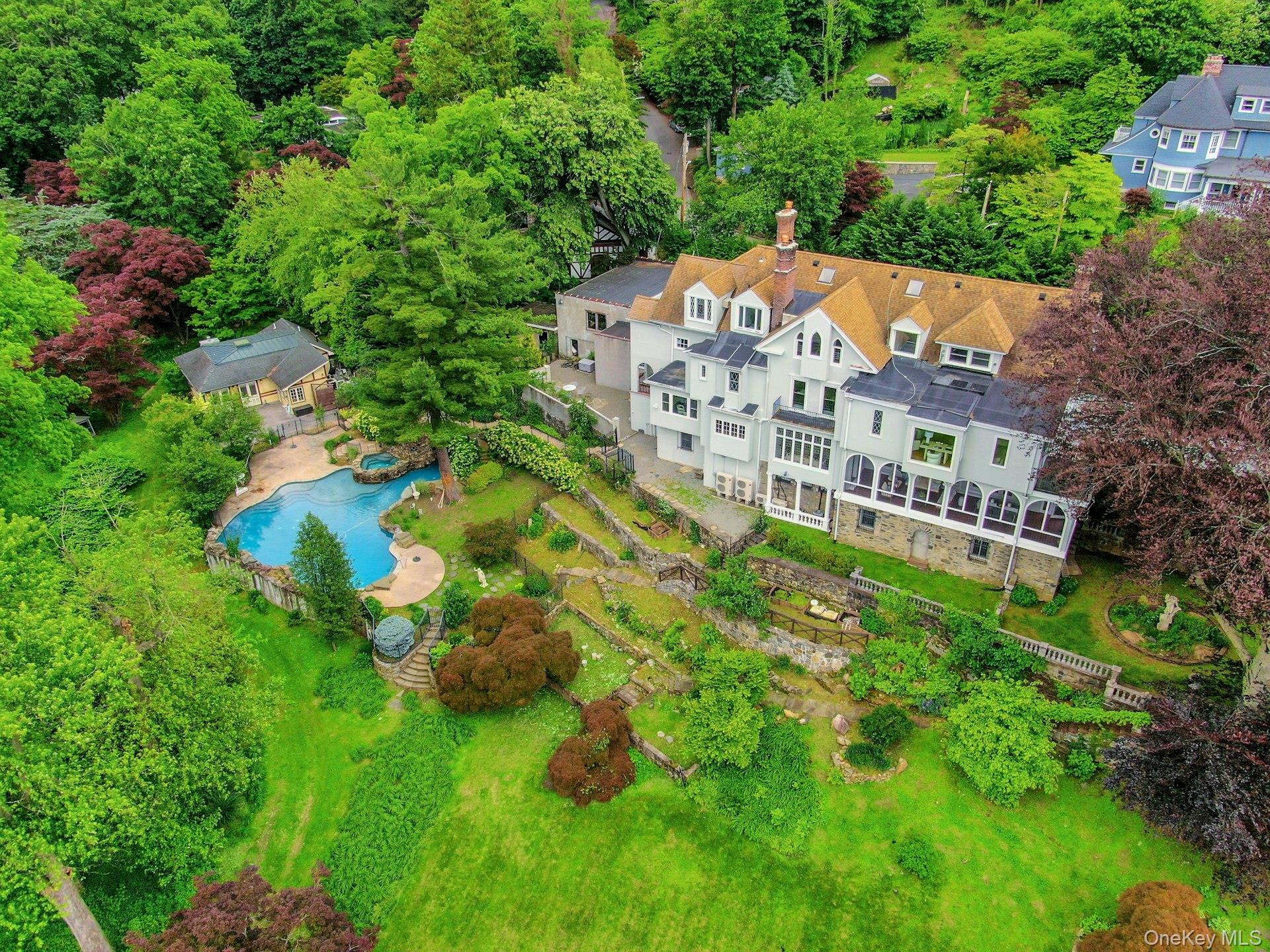 Perched above the Hudson River on 3.5 gated acres in the heart of Tarr...