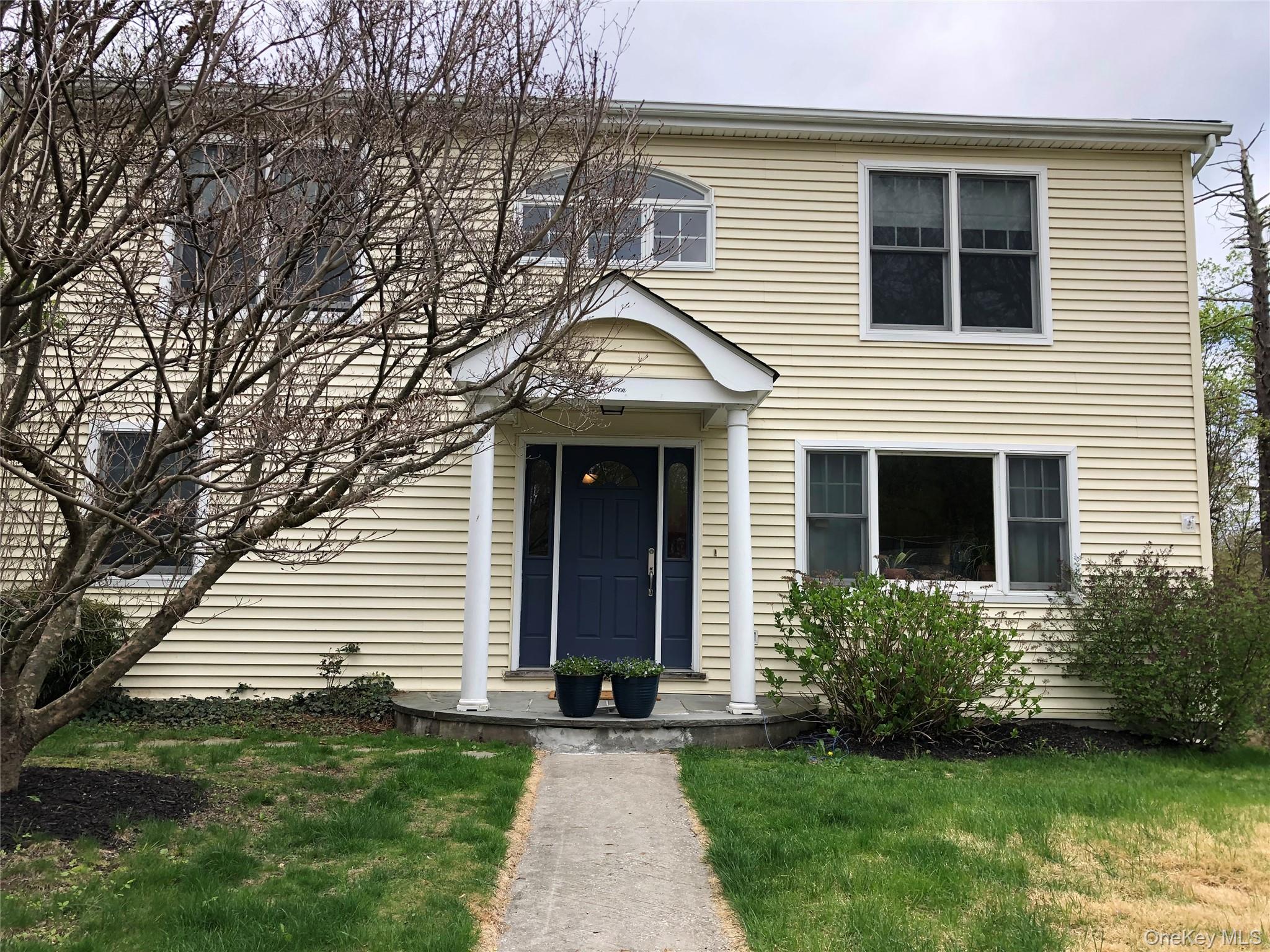 Spacious colonial-style home set on two private acres at the end of a...