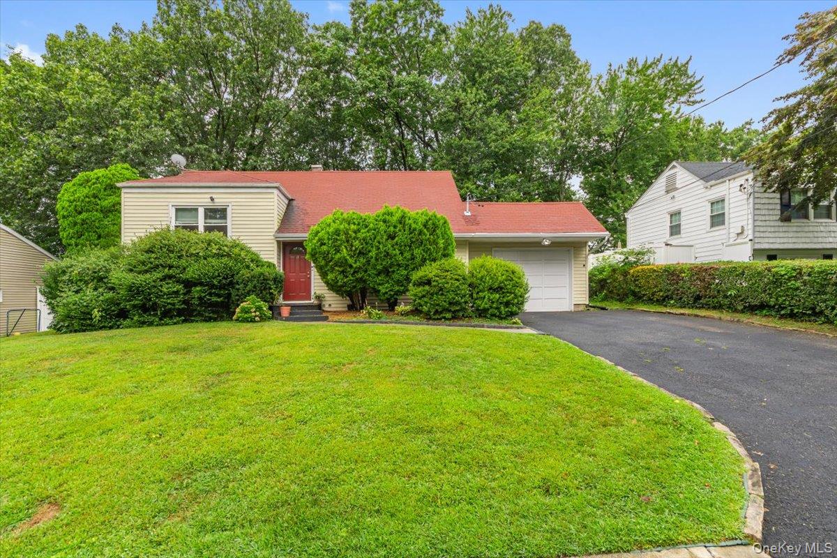 Welcome to this spacious and beautifully maintained split-level home i...