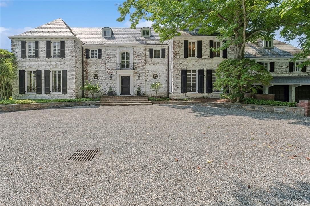 Nestled on 10 ACRES of private property, this Georgian-inspired Coloni...