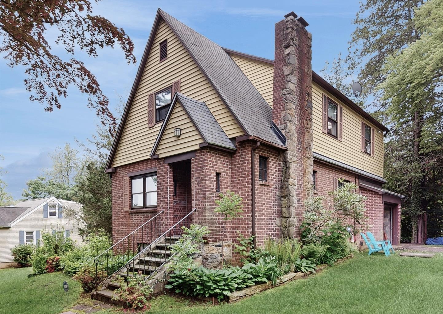 Welcome to this charming brick Tudor on a level corner lot in the Byra...