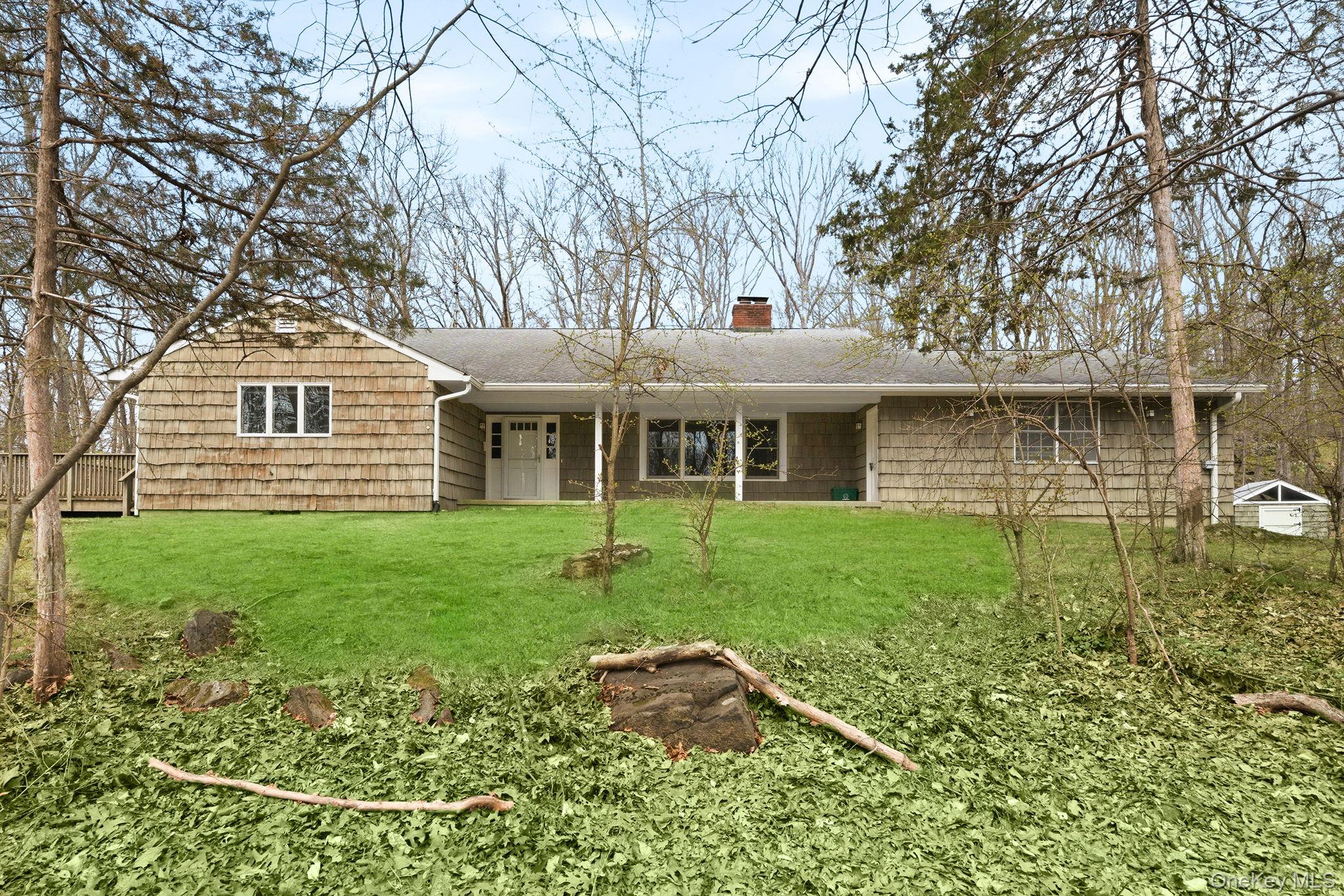 Tucked away on over 4.3 private, wooded acres on Croton Lake Rd in Yor...