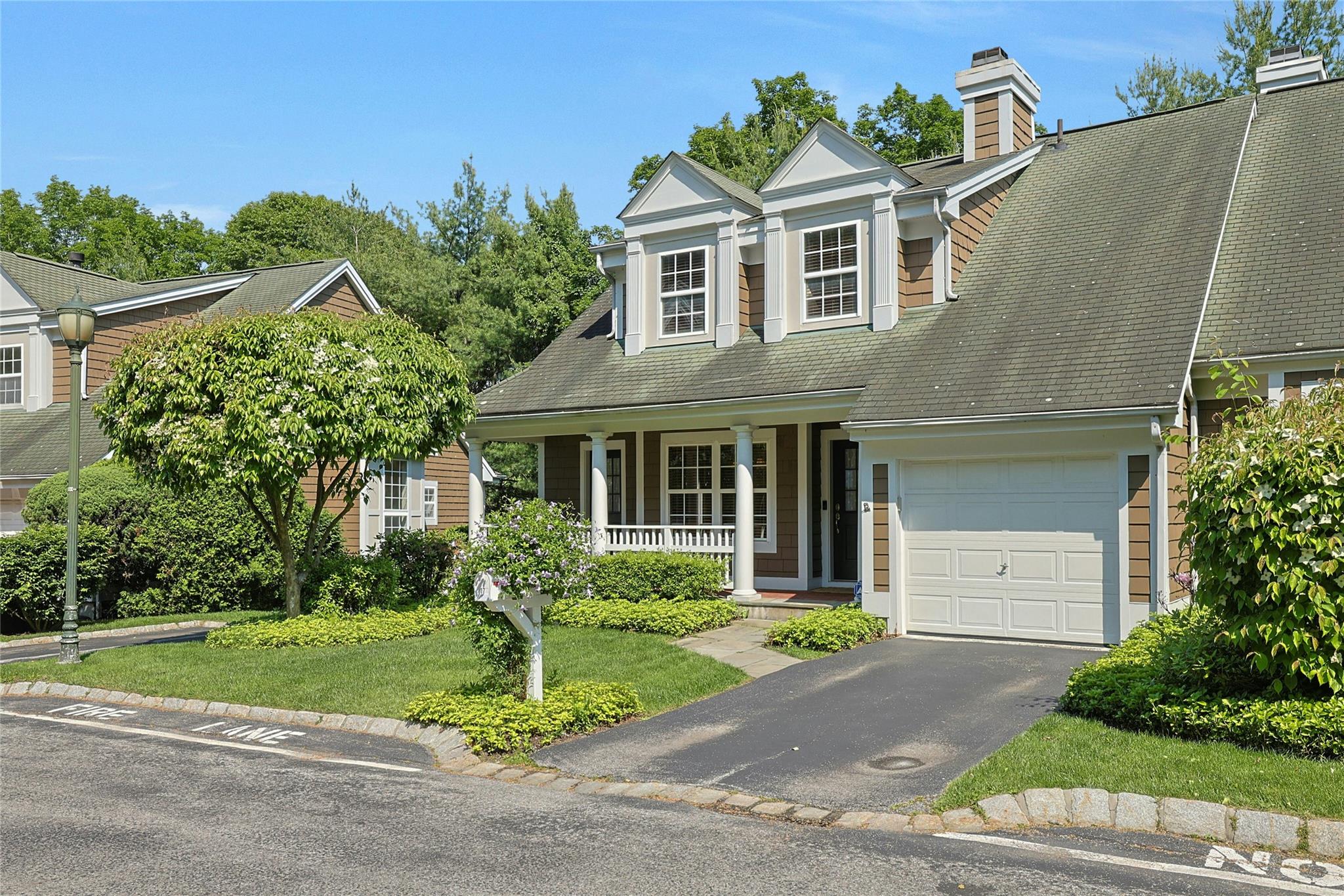 Welcome to this move-in ready end-unit townhome that lives like a 3 be...