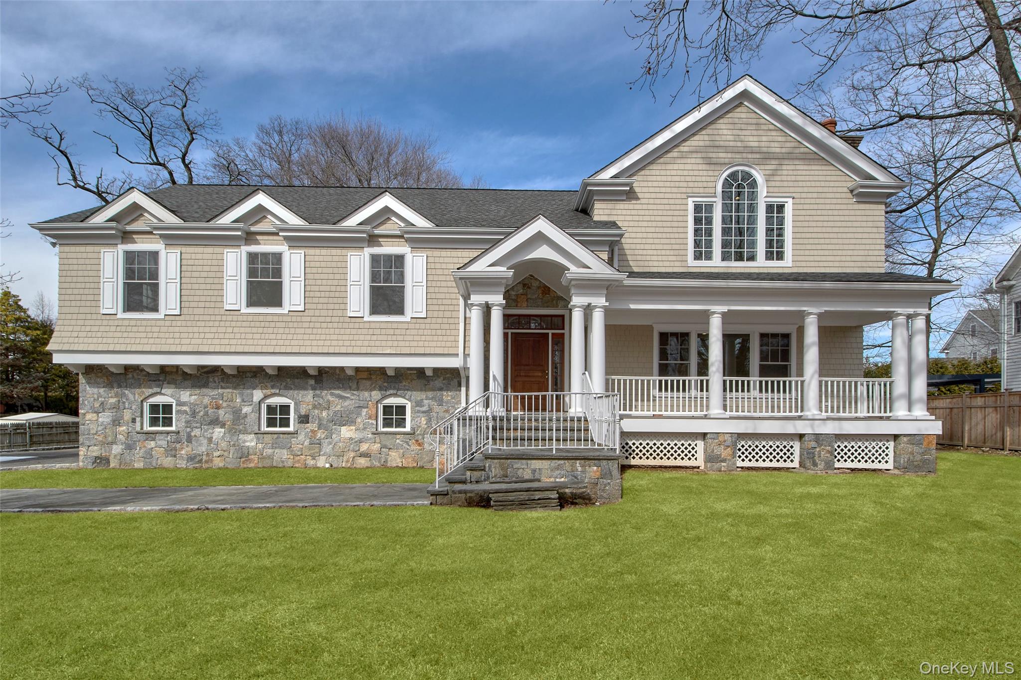 Welcome home to this charming Colonial with a picturesque front porch...
