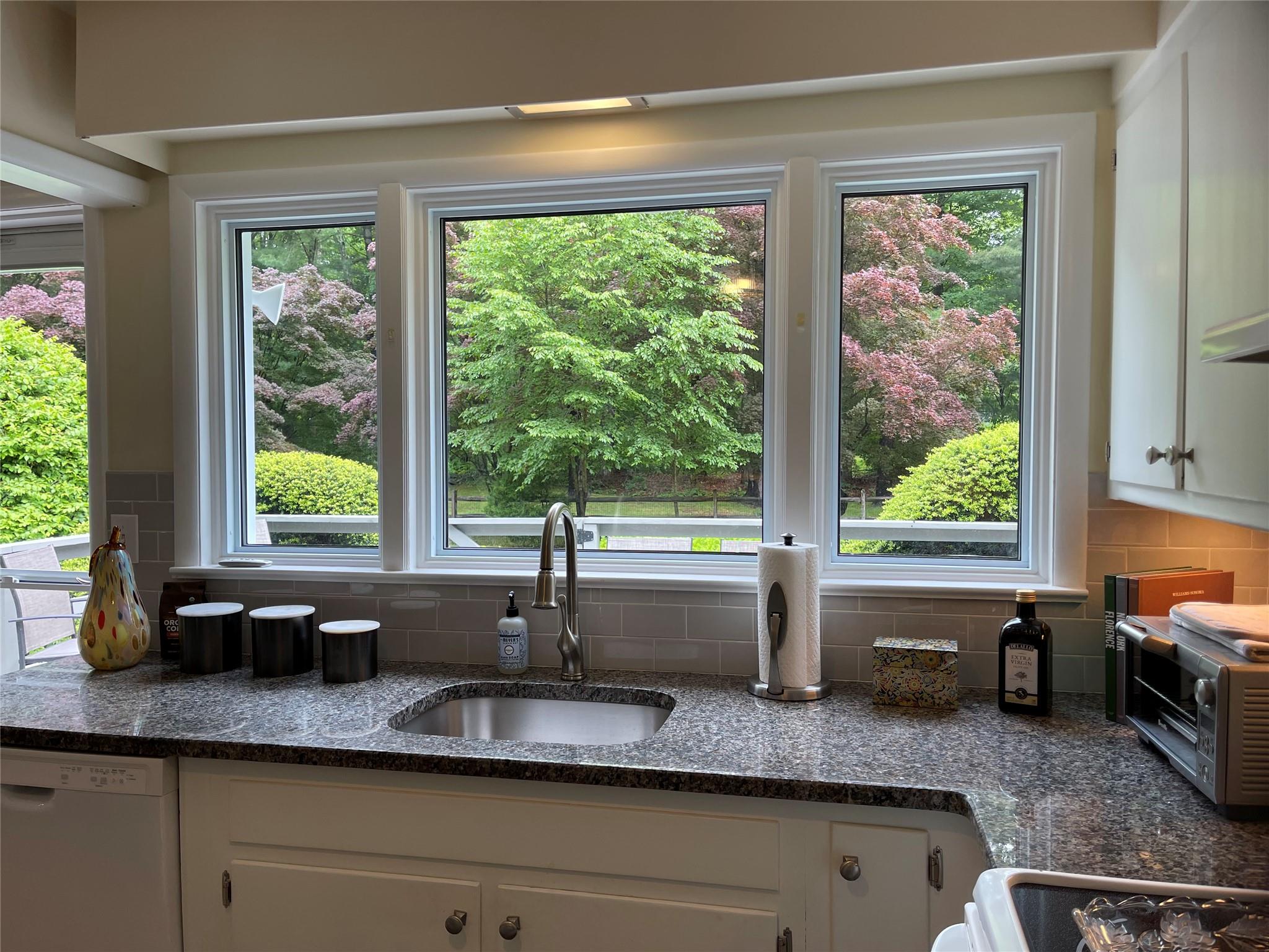 Charming Country Ranch with beautiful Lake Views! This lovely and priv...