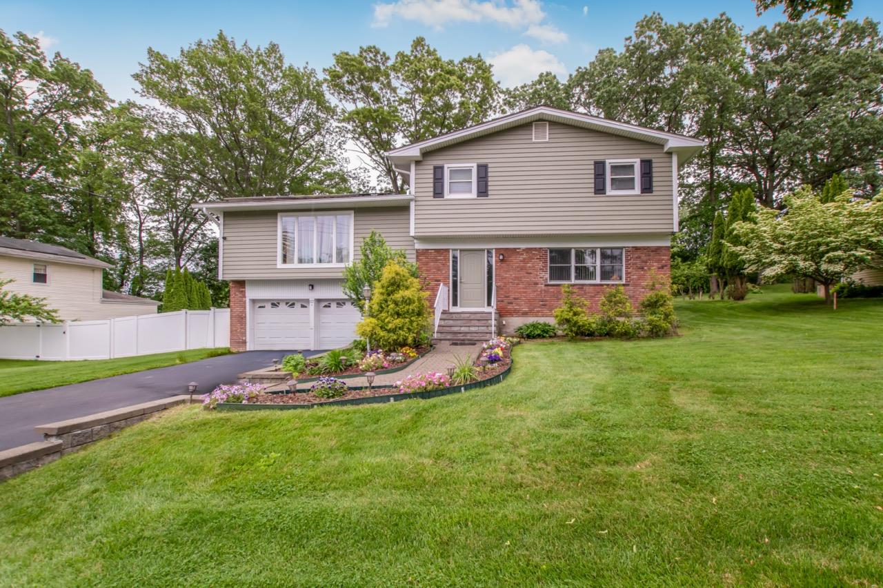 Meticulously maintained split-level home in Elmsford with major upgrad...
