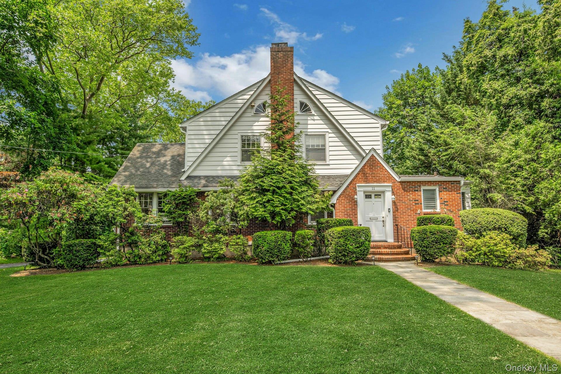 Welcome to this classic Tudor-style home, nestled on over half an acre...