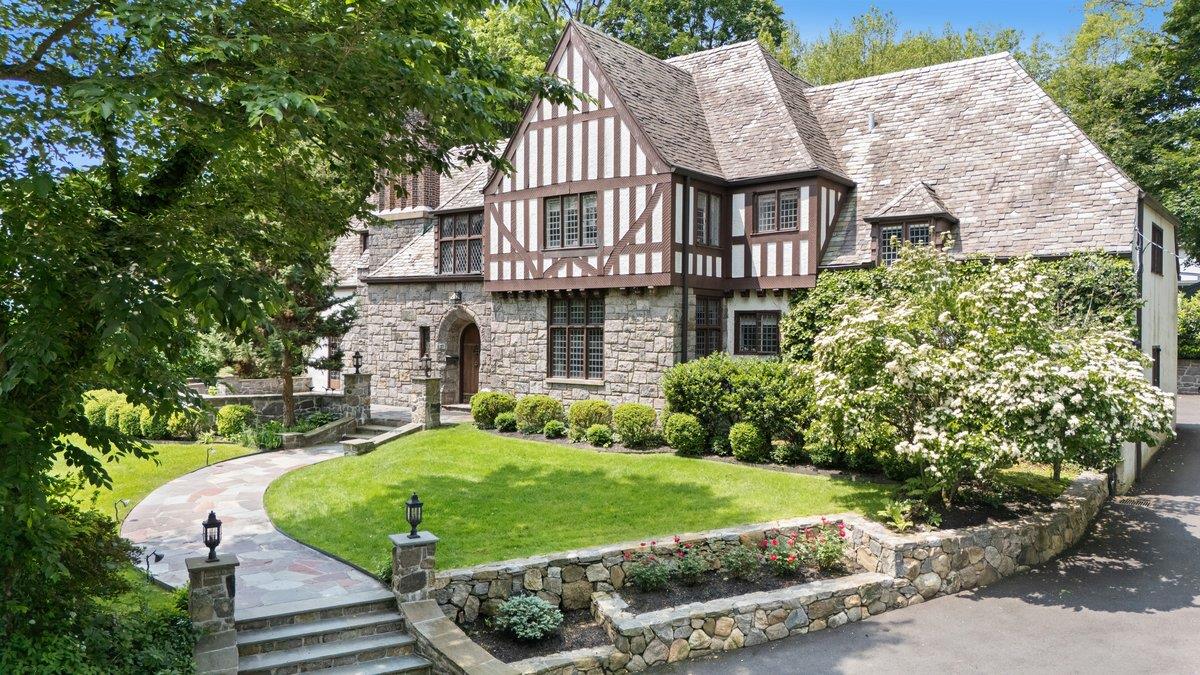 Sophisticated and stylish Edgemont school district Cotswold Tudor is r...