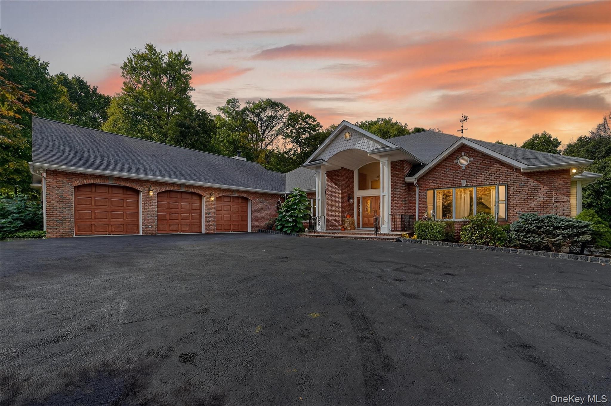 A long driveway leads to this custom-built sprawling ranch set on a se...