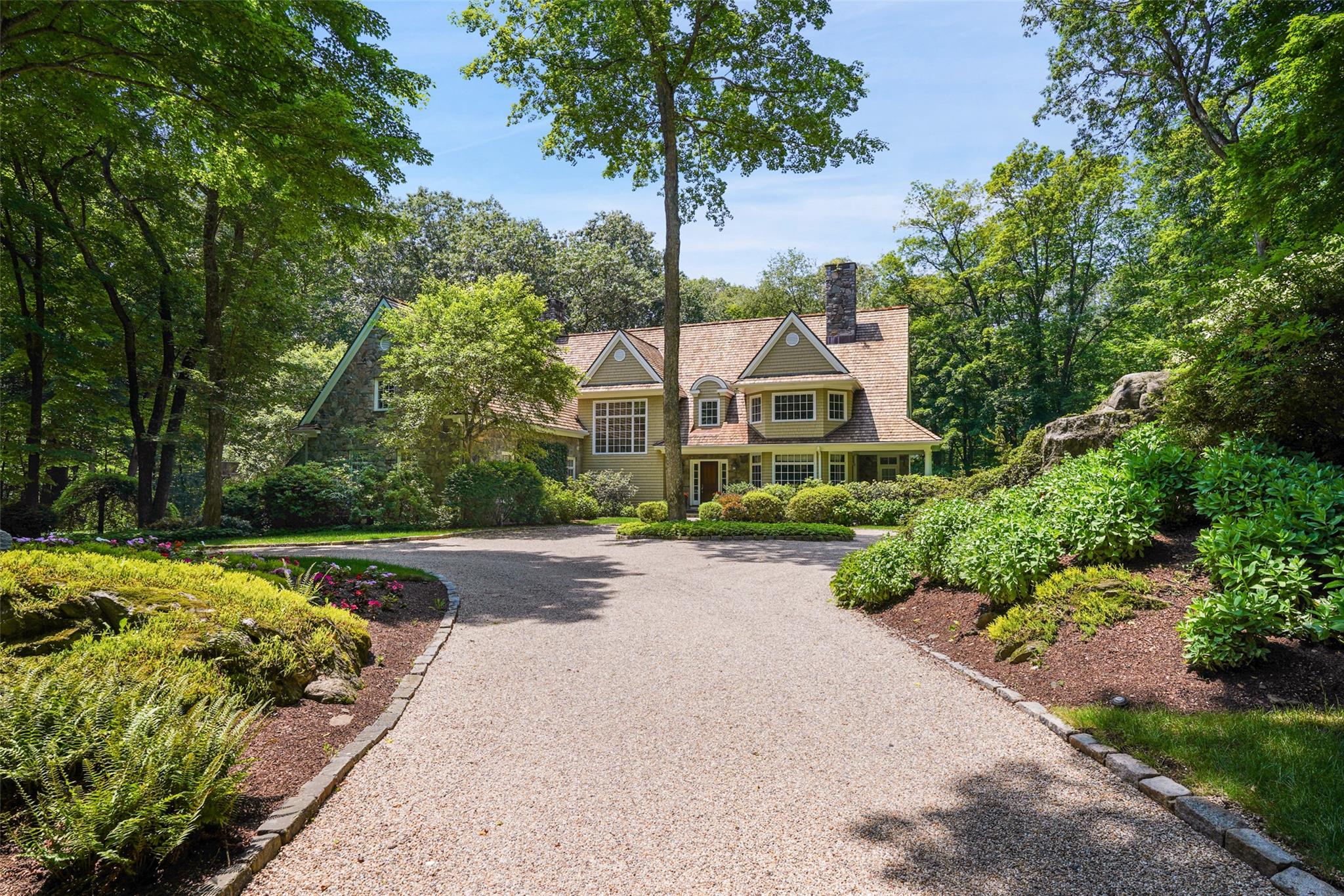 Sophisticated and chic, this immaculate stone and shingle Bedford Vill...