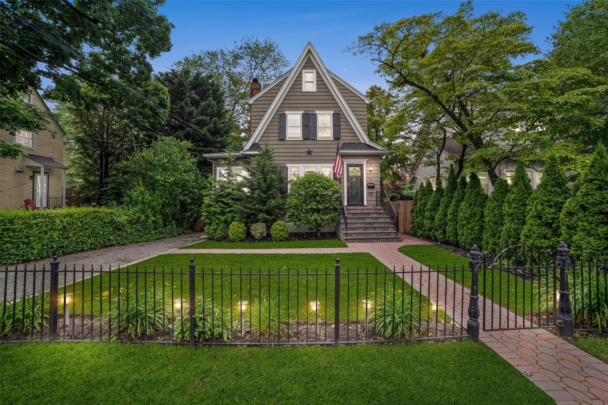 Welcome to this charming and light-filled Colonial nestled in the hear...