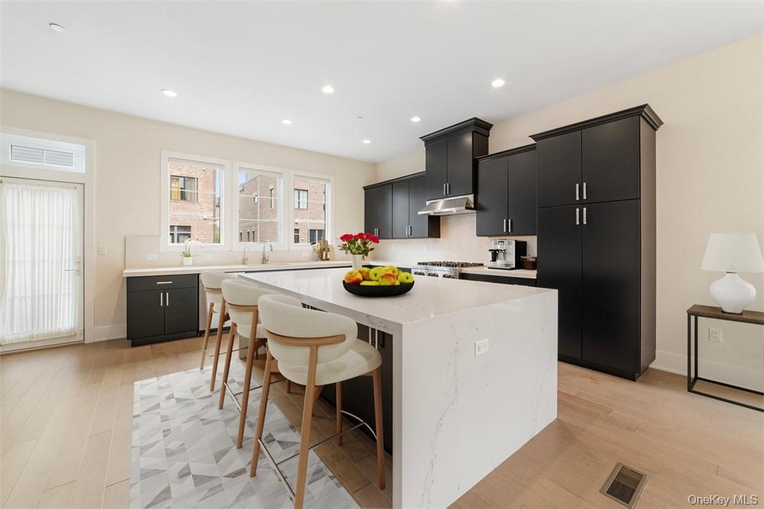 This exquisite end unit, bathed in natural light from its enviable eas...