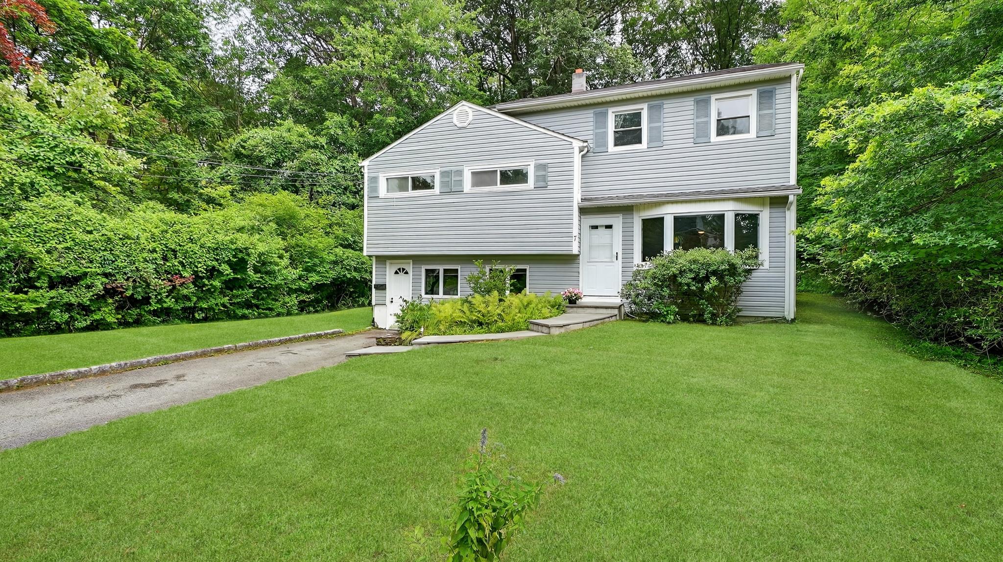 Welcome to this spacious and updated split-level gem, perfectly positi...