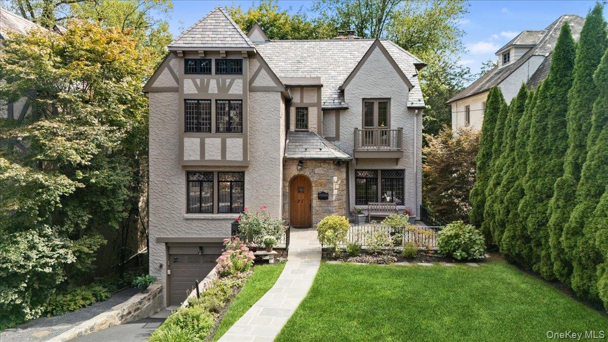 Nestled into the lush canopy of Rouken Glen hamlet, this stunning Tudo...