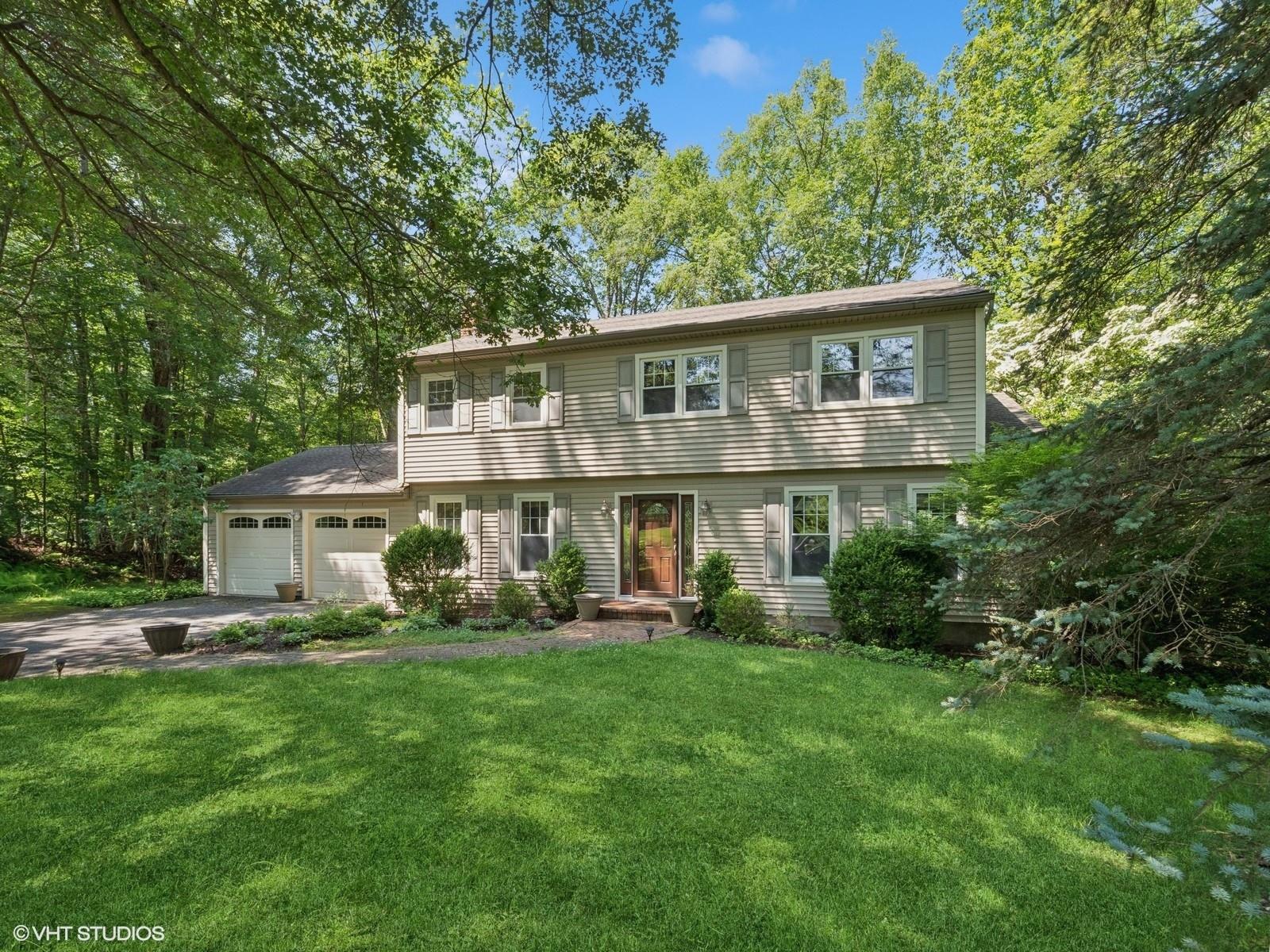 Set on a peaceful, dead-end street, this classic Colonial offers a rar...