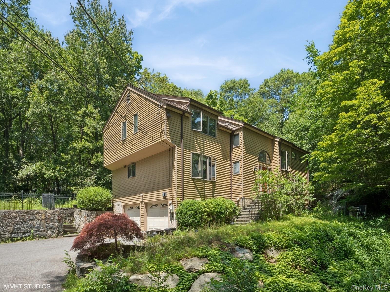 Tucked away on a quiet, wooded lane, this contemporary retreat is all...