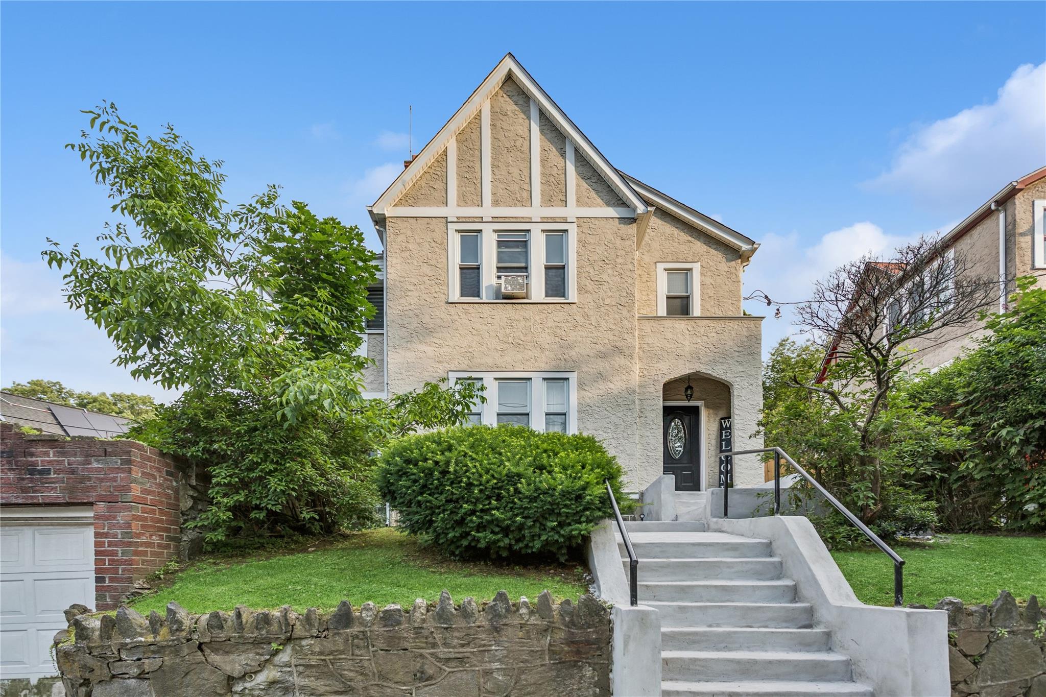 Welcome to this spacious and character-filled Tudor-style single-famil...