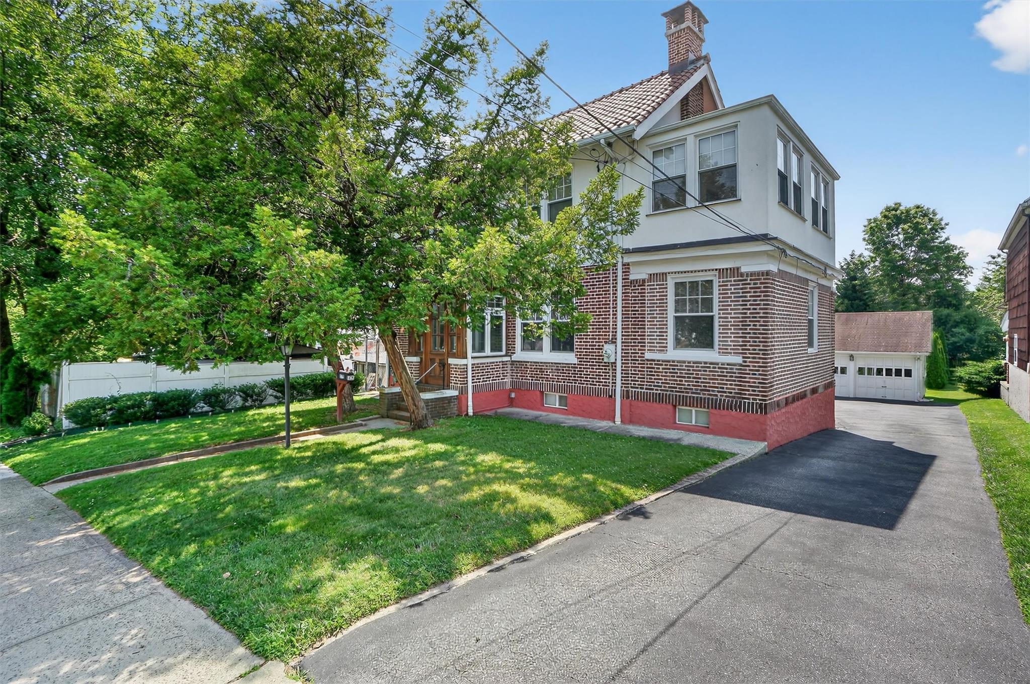 Discover this Charming Brick Colonial with a Full Finished Basement! W...