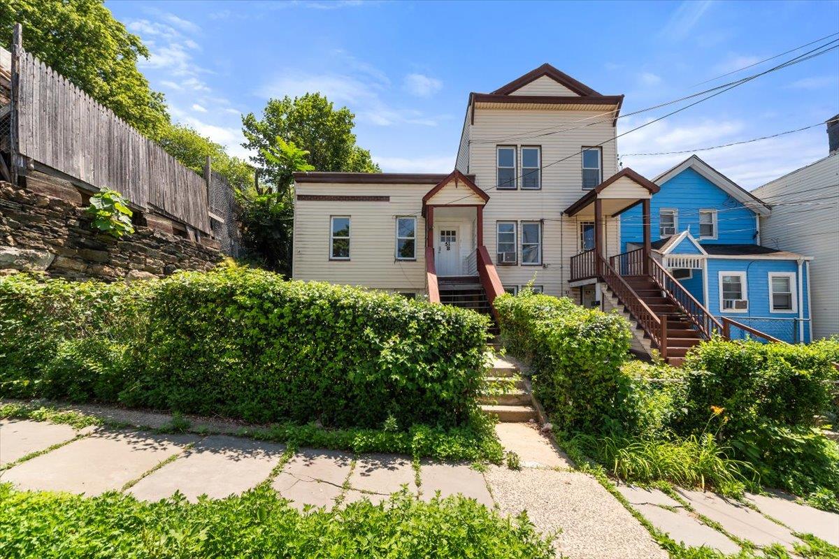 Unlock the ultimate house hack! This fully detached 3-family gem in Mo...