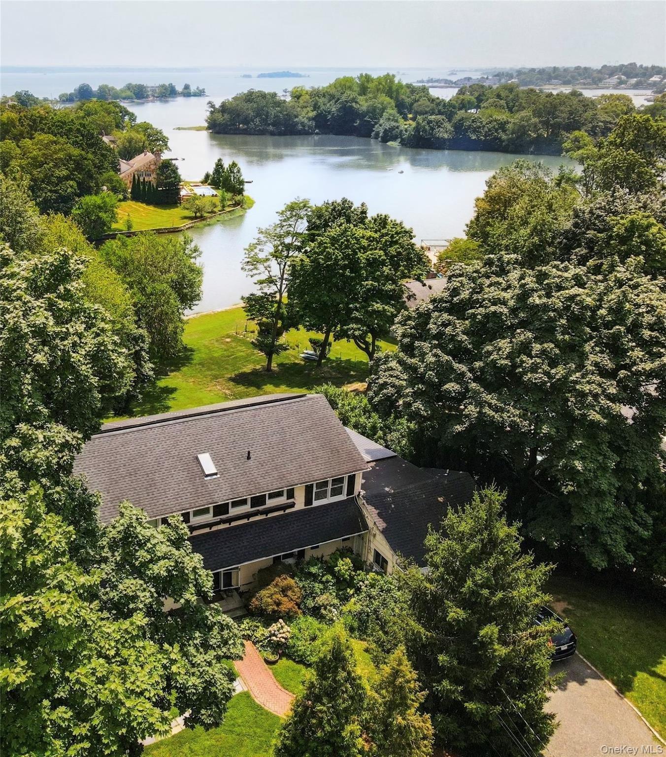 Water front property! Discover timeless waterside elegance at 81 Seavi...