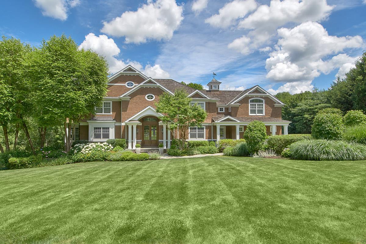 Nestled on over 5 private, professionally landscaped acres in the excl...