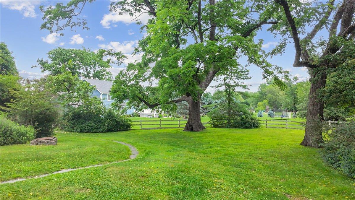 Set on a beautiful acre of land, this 1800s-era home whispers stories...