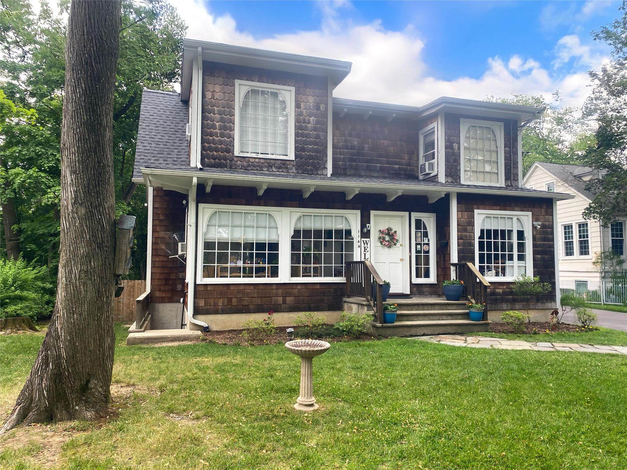 Beautiful colonial with fabulous flat yard.  Nicely set back from the...