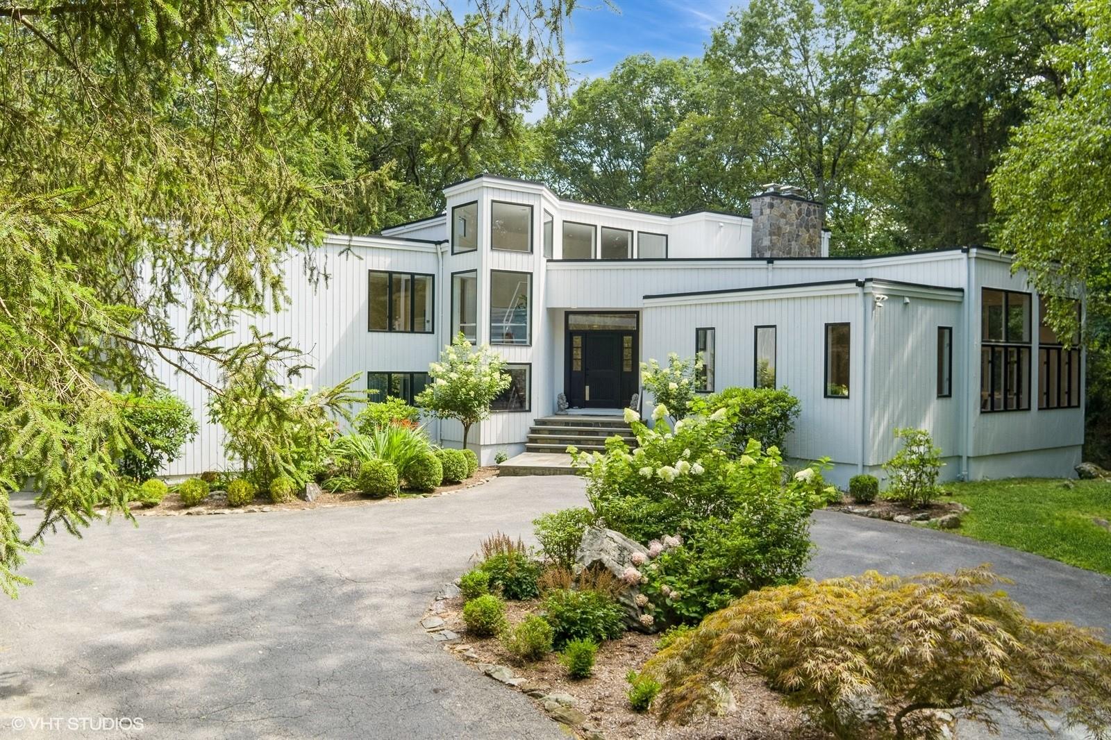 Welcome to this sleek, light-filled Contemporary in Armonk, where open...