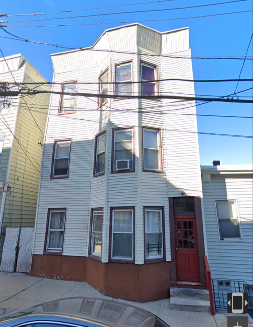 This spacious 3 family with long term tenants is currently leased mont...