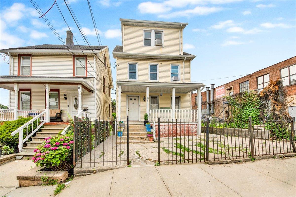 Discover this versatile and inviting two-family residence situated jus...