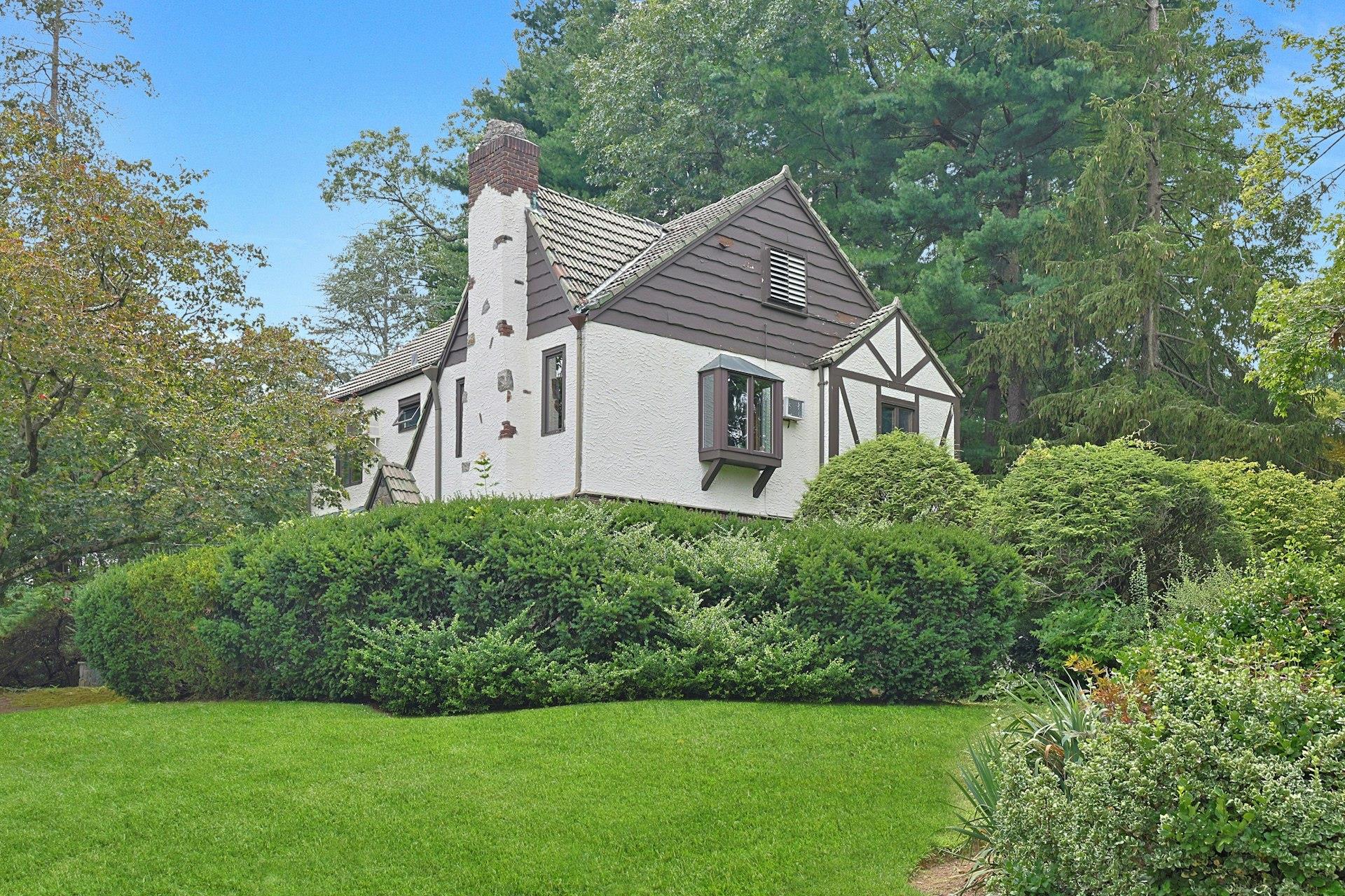 Charming brick and stone Tudor home on one of the prettiest streets in...