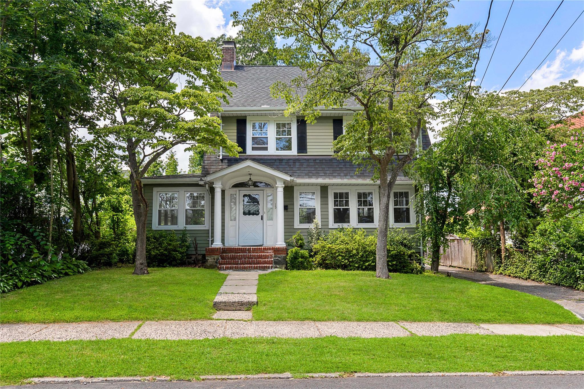 Welcome to this bright and charming 4-bedroom Colonial nestled on a be...