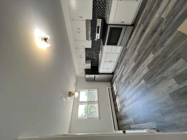 Private home on a quiet street.  The eat-in kitchen a large with stain...