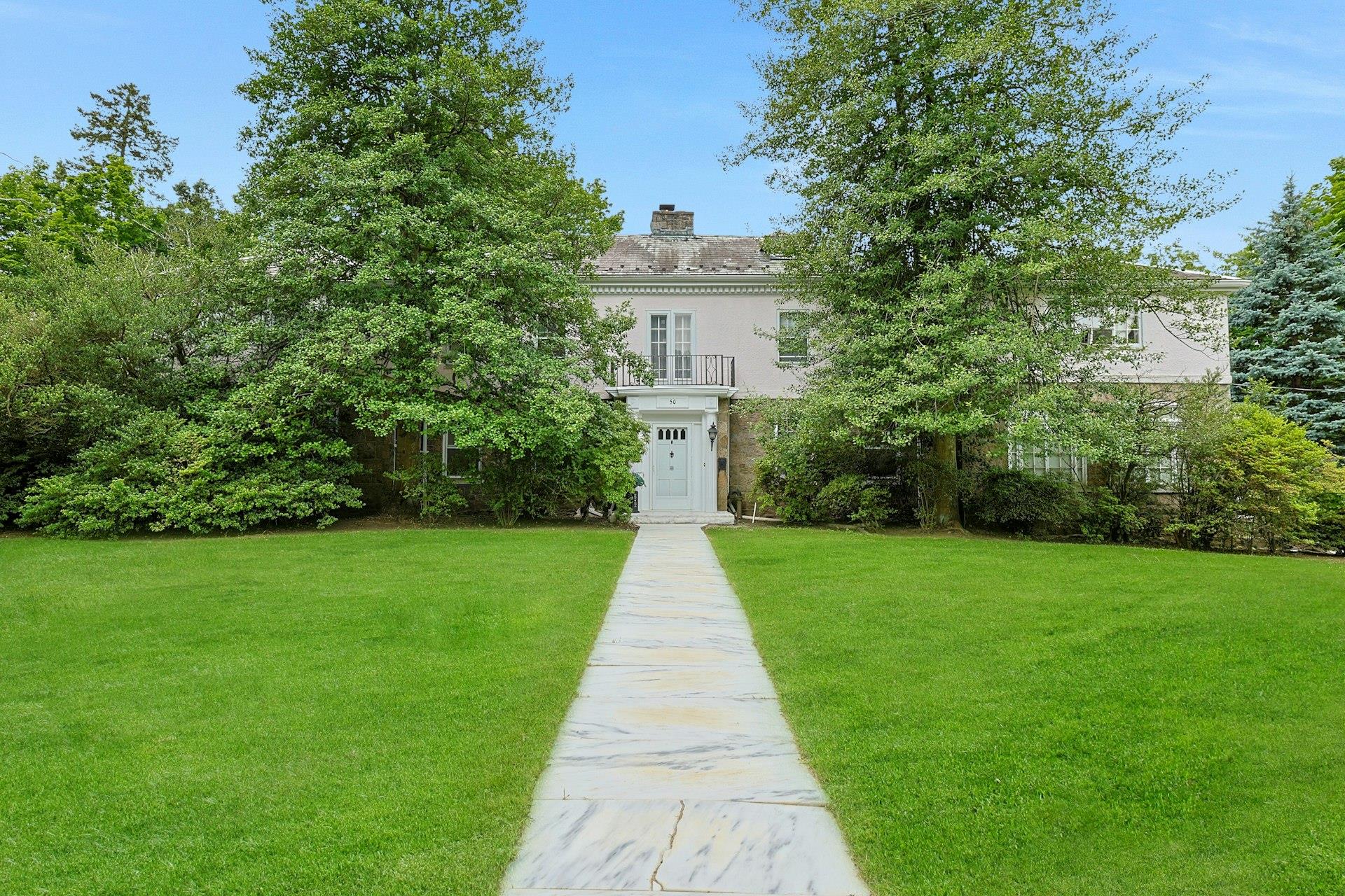 This stone & stucco Center Hall Colonial has great flow, street presen...