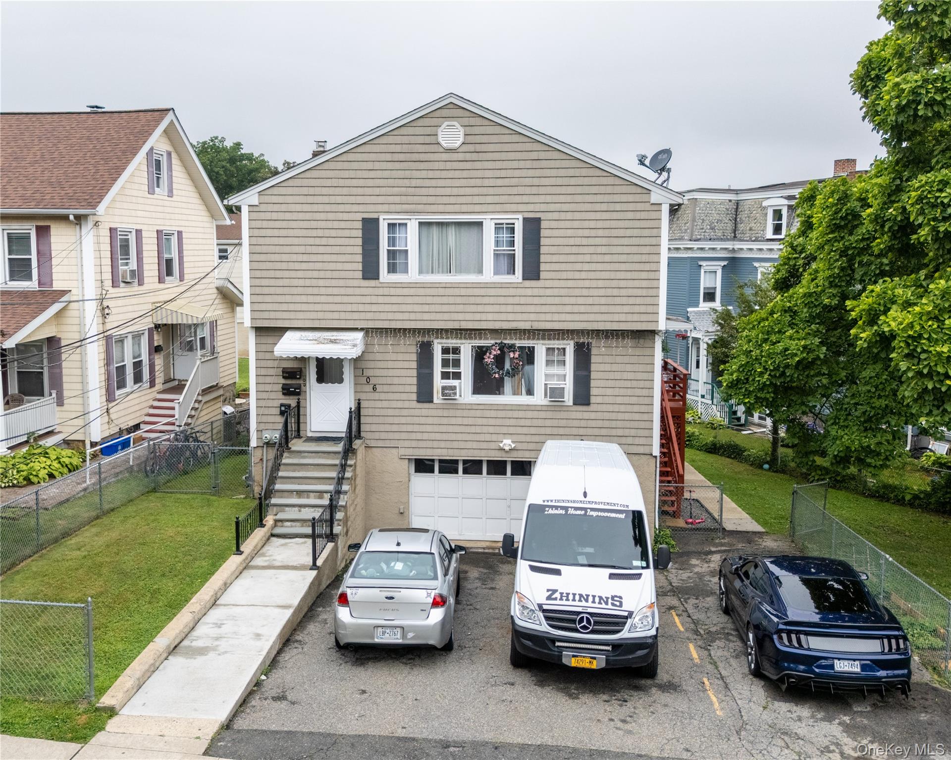 Well Maintained 2 Family with large level manicured lawn in rear and p...